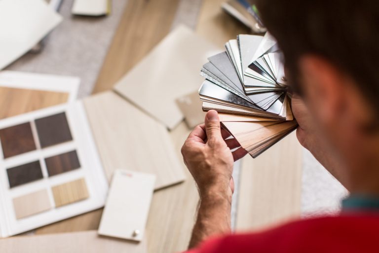 man choosing flooring options