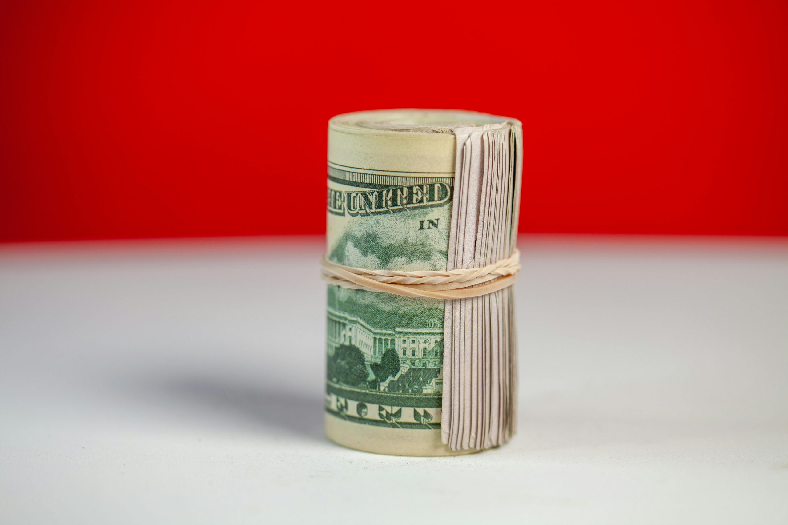 stack of dollar bills held together with a rubber band